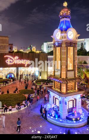 Shanghai, China - October 4, 2017: Amazing night view of clock tower and the Disney Flagship Store at the Pudong New District (Lujiazui) in downtown. Stock Photo