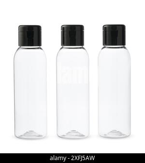 Three Clear Plastic Bottles With Black Caps on a White Background Stock Photo