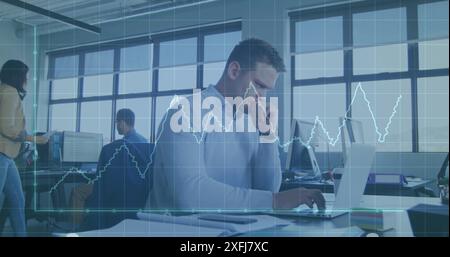 Image of graph and grid pattern over thoughtful caucasian man analyzing reports on laptop Stock Photo