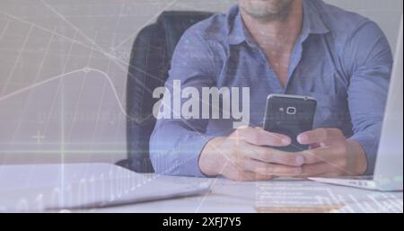 Image of graphs, binary codes, trading board over caucasian businessman using smartphone Stock Photo
