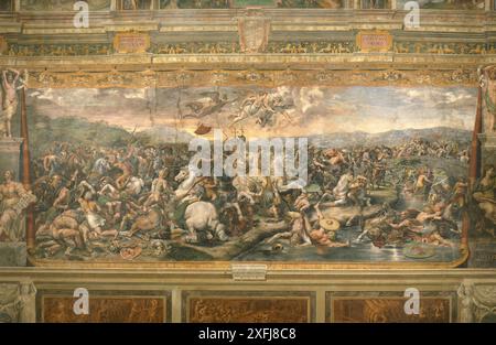 The Battle of Milvian Bridge, located in the Sala di Costantino ('Hall of Constantine'), is by Giulio Romano and other assistants of the Italian Renaissance artist Raphael, who died in 1520 Stock Photo