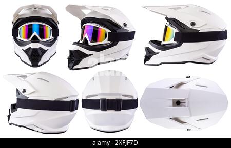 Set collection of White black modern motocross or enduro downhill crash full face helmet in various angles with saftey goggles  isolated background. Stock Photo