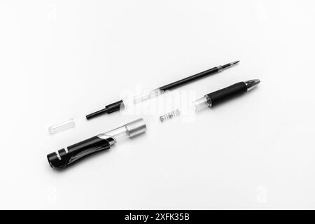 Disassembled gel automatic pen with a black gel rod on a white background Stock Photo
