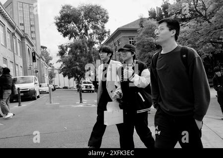 Group of friends walking and having fun in the university Stock Photo