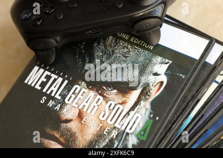 KYIV, UKRAINE - JUNE 26, 2024 Metal Gear Solid Delta Snake Eater PS5 video game disc box for console gaming. Popular video game disc close up Stock Photo