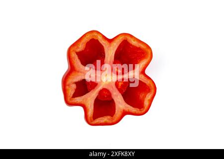 Sliced in half flower shaped tomato fruit,  huge hollow tomato top view close up isolated on white background, Stock Photo