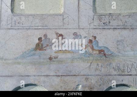 Fresco from the Great Columbarium of Villa Doria Pamphili. Detail with Banquet scene (symposium). Rome, Italy Stock Photo