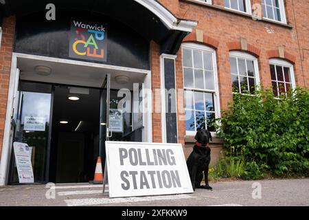 A black Labrador outside a polling station in Warwick during the 2024 ...