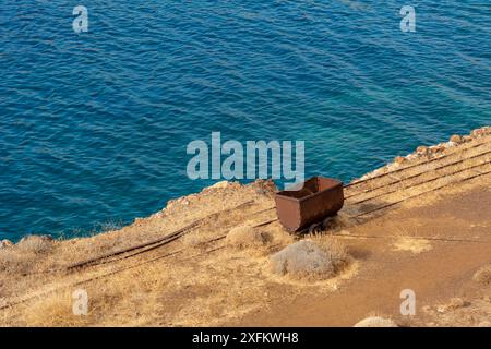 Old wagon in an abandoned mine on the island of Serifos. Cyclades, Greece Stock Photo