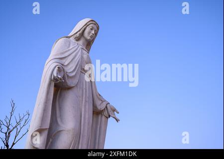 A statue of the Queen of Peace in a Community in Medjugorje, Bosnia and Herzegovina. Stock Photo