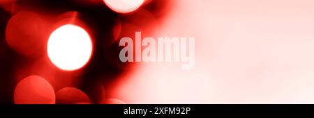 Blurred lights red background, banner texture. Abstract bokeh with soft light header. Wide screen wallpaper. Panoramic web banner with copy space for Stock Photo