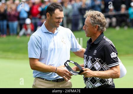 04 July 2024, Bavaria, München/Eichenried: Golf: BMW International Open, 1st round, German golf pro Martin Kaymer (l) shakes hands with Bernhard Langer after the round. Photo: Christian Kolbert/Kolbert-Press/dpa Stock Photo