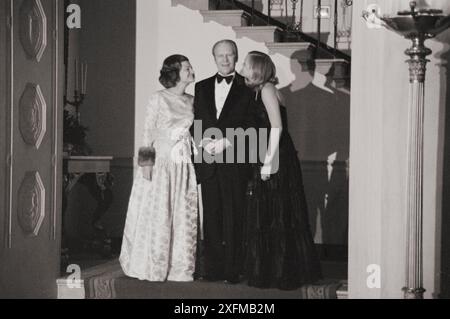 Vintage photo of president Gerald Ford, First Lady Betty Ford, and daughter Susan Ford at a White House Christmas party, Washington, D.C. USA, 1975 Dec. 17. By T. O'Halloran Stock Photo