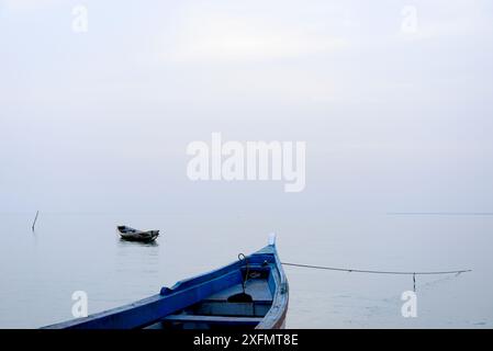 Boats in Atlantic Ocean, Orango Island, Bijagos UNESCO Biosphere Reserve, Guinea Bissau, February 2015. Stock Photo