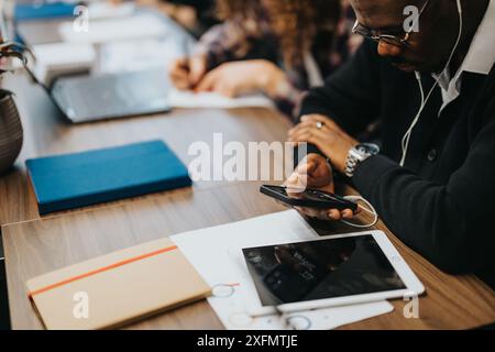 Multiracial team in a business meeting, collaborating on a project in a modern office environment Stock Photo