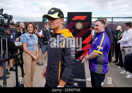 McLaren's Lando Norris (left) playing darts with Luke Littler in the ...