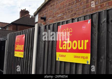 Slough, Berkshire, UK. 4th July, 2024. Vote Labour signs outside a property in Slough, Berkshire today on General Election Day. Labour are predicted to hold their seat after voting today. Credit: Maureen McLean/Alamy Live News Stock Photo