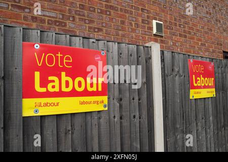 Slough, Berkshire, UK. 4th July, 2024. Vote Labour signs outside a property in Slough, Berkshire today on General Election Day. Labour are predicted to hold their seat after voting today. Credit: Maureen McLean/Alamy Live News Stock Photo