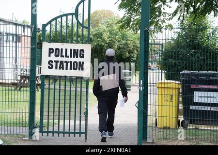 Slough, Berkshire, UK. 4th July, 2024. Voters at a Polling Station in Manor Park, Slough, Berkshire today on General Election Day. Labour are predicted to hold their seat in Slough after voting today. Credit: Maureen McLean/Alamy Live News Stock Photo