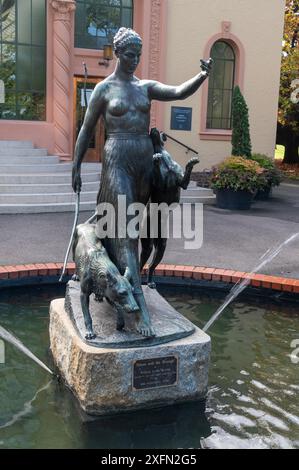 A water fountain of Diane and the hounds outside the conservatory in Fitzroy gardens, Melbourne in Victoria, Australia.  Diana was the goddess of hunt Stock Photo