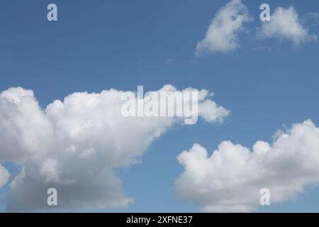 Clouds in a blue sky ,white fluffy clouds on a back ground of blue sky on a summers day Knottingley West Yorkshire In UK Stock Photo