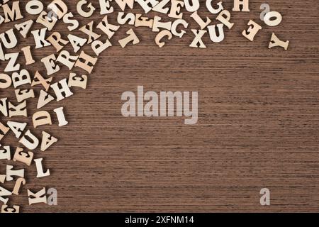 Vintage Wooden Letters on Brown Wooden Background Copy Space Stock Photo