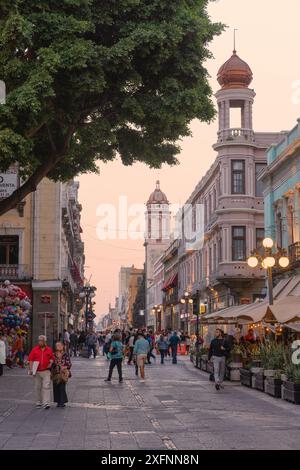 UNESCO World Heritage site Mexico, people in the Historic Center Puebla, Mexico; street scene at sunset; Puebla Mexico Stock Photo