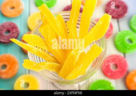 dried cantaloupe sticks on wood background top view Stock Photo