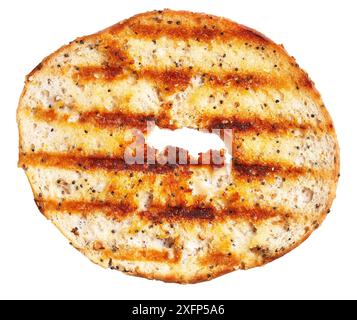 Toasted bagel with seeds isolated on white background showing texture and golden-brown crust. Stock Photo