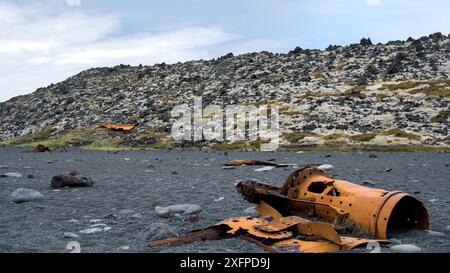 Abandoned rusty ship wreck on black volcanic sand in Iceland in the bay of Dritvik Stock Photo