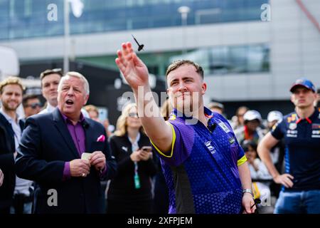 NORTHAMPTONSHIRE, UNITED KINGDOM. 04th Jul, 24. Luke Littler (English professional darts player) took the Darts Challenge on Thursday during Qatar Airways British Grand Prix 2024 at Silverstone Circuit on Thursday, July 04, 2024 in NORTHAMPTONSHIRE, ENGLAND. Credit: Taka G Wu/Alamy Live News Stock Photo