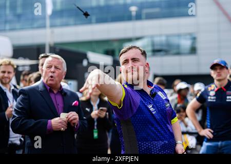 NORTHAMPTONSHIRE, UNITED KINGDOM. 04th Jul, 24. Luke Littler (English professional darts player) took the Darts Challenge on Thursday during Qatar Airways British Grand Prix 2024 at Silverstone Circuit on Thursday, July 04, 2024 in NORTHAMPTONSHIRE, ENGLAND. Credit: Taka G Wu/Alamy Live News Stock Photo