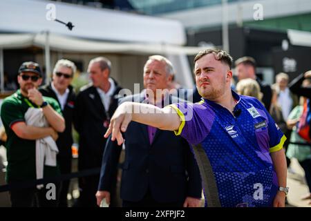 NORTHAMPTONSHIRE, UNITED KINGDOM. 04th Jul, 24. Luke Littler (English professional darts player) took the Darts Challenge on Thursday during Qatar Airways British Grand Prix 2024 at Silverstone Circuit on Thursday, July 04, 2024 in NORTHAMPTONSHIRE, ENGLAND. Credit: Taka G Wu/Alamy Live News Stock Photo