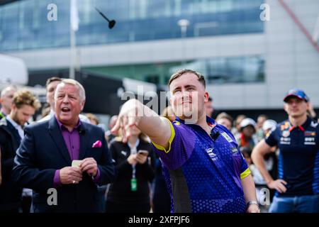 NORTHAMPTONSHIRE, UNITED KINGDOM. 04th Jul, 24. Luke Littler (English professional darts player) took the Darts Challenge on Thursday during Qatar Airways British Grand Prix 2024 at Silverstone Circuit on Thursday, July 04, 2024 in NORTHAMPTONSHIRE, ENGLAND. Credit: Taka G Wu/Alamy Live News Stock Photo