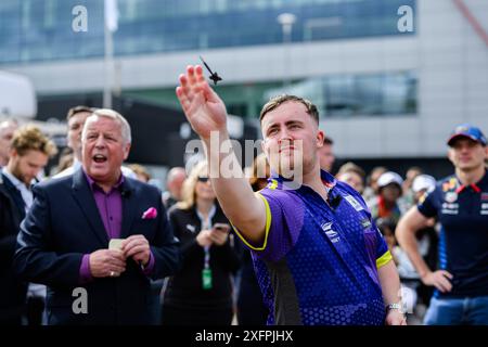 NORTHAMPTONSHIRE, UNITED KINGDOM. 04th Jul, 24. Luke Littler (English professional darts player) took the Darts Challenge on Thursday during Qatar Airways British Grand Prix 2024 at Silverstone Circuit on Thursday, July 04, 2024 in NORTHAMPTONSHIRE, ENGLAND. Credit: Taka G Wu/Alamy Live News Stock Photo