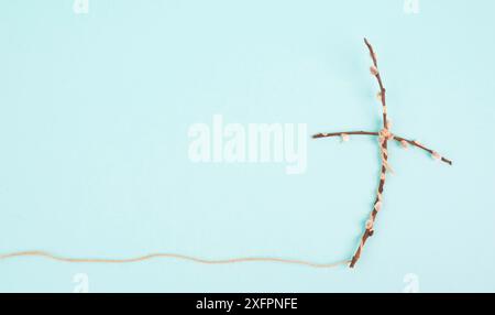 Religious cross made from willow branches, belief, faith and spirituality in religon, resurrection of Jesus Christ at Easter, christianity Stock Photo