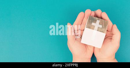 Wooden house with a religious cross, christian church, belief and faith concept, catholic and protestant community Stock Photo