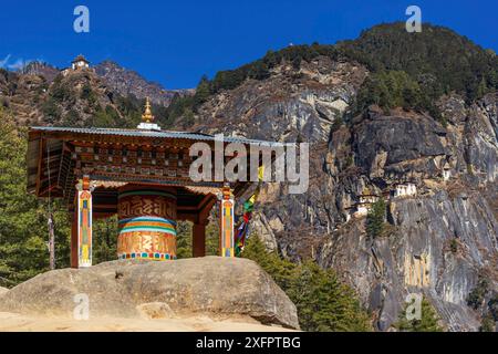 View of the Taktshang monastery in Paro with prayer wheel in the front Stock Photo