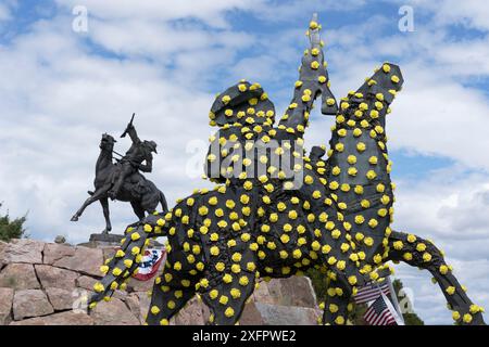 Hundredth anniversary, 'The Scout' statue of Buffalo Bill Cody celebrated July4,2024, Cody, Wyoming. Horseman salute monument. Yellow rose parade copy. Stock Photo