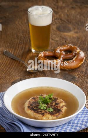 Austrian cheese dumpling soup on wood Stock Photo