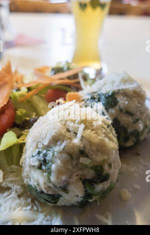 Spinach dumplings with mixed salad Stock Photo