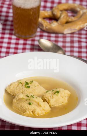 Bavarian dumpling soup on a tablecloth Stock Photo