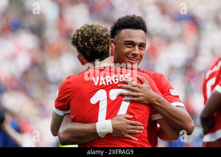 Ruben Vargas   seen  celebrating with Dan Ndoye after scoring goal during  UEFA Euro 2024 Round of 16  game between national teams of Switzerland and Stock Photo