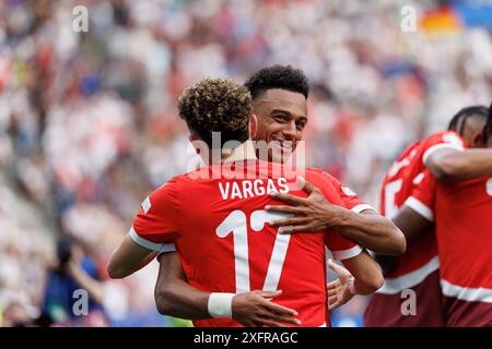Ruben Vargas   seen  celebrating with Dan Ndoye after scoring goal during UEFA Euro 2024 Round of 16  game between national teams of Switzerland and I Stock Photo