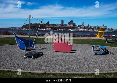 Children's playground equipment with Quebec City at Quai Paquet park in Levis, Quebec, Canada Stock Photo