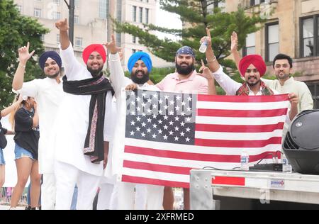 St. Louis, United States. 04th July, 2024. Men from the Sikh Study Circle, hold an American flag and wave to the crowd during the America's Birthday Parade in St. Louis on Thursday, July 4, 2024. Photo by Bill Greenblatt/UPI Credit: UPI/Alamy Live News Stock Photo