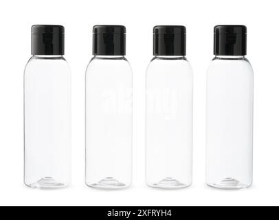 Four Clear Plastic Bottles With Black Caps on a White Background Stock Photo