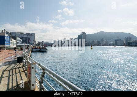 Busan, South Korea - October 7, 2017: Amazing view of Busan Harbor. The city is visible on blue sky background. Stock Photo