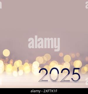 Metal numbers 2025 on table with bokeh lights Stock Photo - Alamy