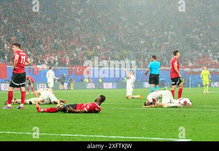 Michael Gregoritsch, AUT 11 Kevin Danso, AUT 4 , sad after final whistle ,  Salih Oezcan, Tuerkiye 15 celebrate in the best of 16 match AUSTRIA  - TueRKIJE 1-2 of the UEFA European Championships 2024  on Jul 02, 2024  in Leipzig, Germany.  Photographer: ddp images / star-images Stock Photo